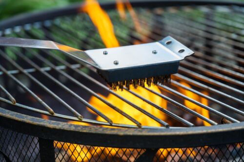 Close-up of a lit gas barbecue grill after cooking. Visual concept for a personal injury blog on liability for gas grill explosion injuries.