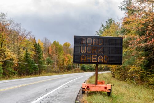 Electronic road sign indicating roadworks ahead. Visual concept for a blog discussing Ohio's updated move over laws.